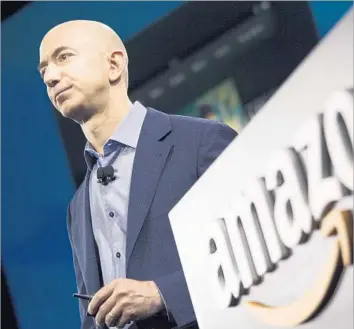  ?? David Ryder Getty Images ?? JEFF BEZOS, founder and CEO of Amazon.com, is shown in 2014. At $1,000 per share, Amazon’s market capitaliza­tion is about $478 billion, which ranks fourth in the U.S. behind Apple, Alphabet and Microsoft.