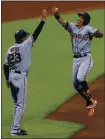  ?? AARON DOSTER — THE ASSOCIATED PRESS ?? The Giants’ Mauricio Dubon, right, high-fives third-base coach Ron Wotus after hitting a homer during Monday’s win over the Reds.