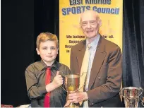  ??  ?? Veteran prize Frederick Cowan, 84, with his award, presented by Ruairidh McKillop, grandson of the late George McKillop