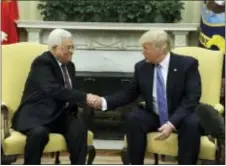  ?? EVAN VUCCI — THE ASSOCIATED PRESS ?? President Donald Trump shakes hands with Palestinia­n leader Mahmoud Abbas during their meeting in the Oval Office of the White House, Wednesday in Washington.