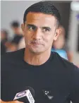  ??  ?? Tim Cahill arrives in Sydney.