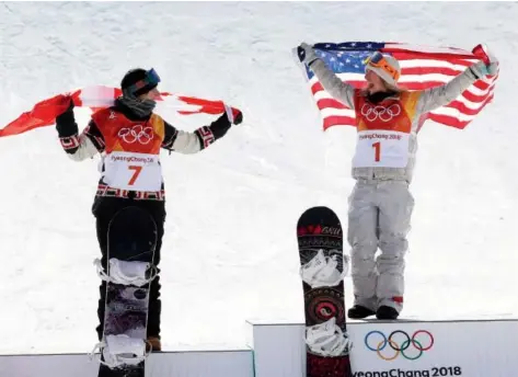  ??  ?? Silver medallist Laurie Blouin of Canada, left, and gold medallist Jamie Anderson of the U. S. are happy to be on the podium after the women’s slopestyle event at the Phoenix Snow Park on Monday. Unpredicta­ble, strong winds made the final a war of attrition. Jean Levac