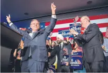  ?? Tom Gralish, The Philadelph­ia Inquirer ?? U.S. Sen. Bob Menendez celebrates his re-election in Hoboken, N.J., on Tuesday while Gov. Phil Murphy stands at right.