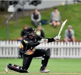  ??  ?? Firebirds batsman Stephen Murdoch tries an unorthodox shot during the T20 match.