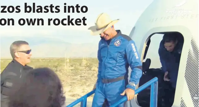  ?? AP ?? In this photo provided by Blue Origin, Jeff Bezos, founder of Amazon and space tourism company Blue Origin, exits the Blue Origin’s New Shepard capsule after it parachuted safely down to the launch area near Van Horn, Texas, Tuesday, July 20, 2021.