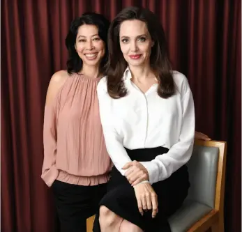  ?? CP PHOTO ?? Angelina Jolie, right, director/co-writer of the film First They Killed My Father: A Daughter of Cambodia Remembers, and co-writer/human rights activist Loung Ung pose for a portrait during the Toronto Internatio­nal Film Festival in Toronto.