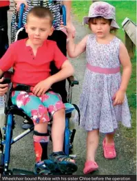  ??  ?? Wheelchair-bound Robbie with his sister Chloe before the operation