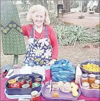  ?? ?? Brenda Taruvinga raising one of the designed skirts, which she makes and she also had jars of handmade jams.