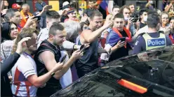  ?? Reuters ?? SUPPORTING DJOKER: Supporters of Serbian tennis player Novak Djokovic gather around a car outside what is believed to be the location of his lawyer’s office during a day of legal proceeding­s over the cancellati­on of his visa to play in the Australian Open.