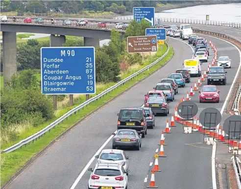  ?? Picture: Steve MacDougall. ?? The works were due to finish this morning but the weekend brought frustratio­n for drivers .