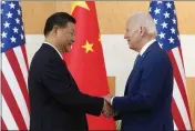  ?? ALEX BRANDON — THE ASSOCIATED PRESS FILE ?? President Joe Biden, right, and Chinese President Xi Jinping shake hands before their meeting on the sidelines of the G20 summit meeting on Nov. 14, 2022, in Bali, Indonesia.