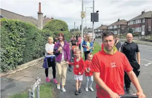  ??  ?? ●●Fifty people took part in the sponsored walk for community defibrilla­tors