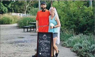  ?? ?? Getting hitched: Regular park runners and volunteers James Carboon and Bre Kent celebrate with the parkrun community before getting married last week.