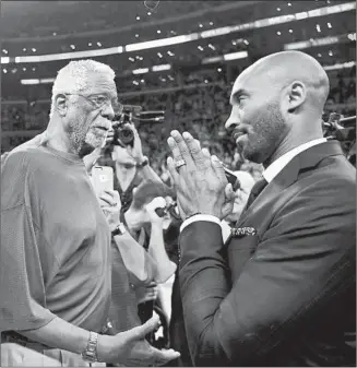  ?? Wally Skalij Los Angeles Times ?? KOBE BRYANT right pays his respects to Bill Russell, one of the many NBA greats and former teammates who turned out for his jersey retirement ceremony at Staples Center.