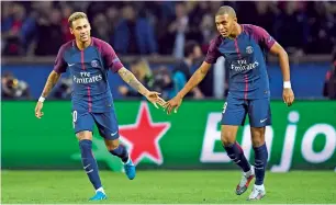  ?? AFP ?? Neymar (left) celebrates with Kylian Mbappe after scoring a goal against Bayern Munich. —