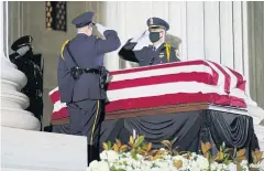  ?? BLOOMBERG ?? Honour Guards salute as the casket of late Supreme Court Justice Ruth Bader Ginsburg lies in repose outside the Supreme Court in Washington, DC.