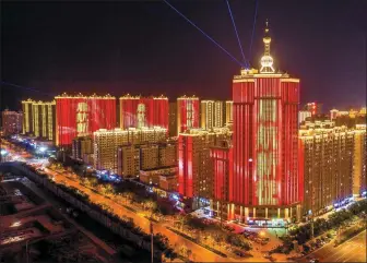  ?? XUE JUN / FOR CHINA DAILY ?? Buildings in Taiyuan are decorated in red to mark the centennial of the CPC.