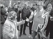  ?? AP/TIM IRELAND ?? An opponent of Britain’s exit from the European Union, wearing a beret fashioned after the EU flag, argues with a supporter of Britain’s departure Tuesday outside London’s House of Parliament.