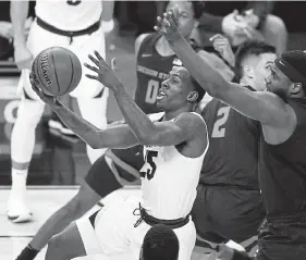  ?? John Locher, The Associated Press ?? Colorado’s McKinley Wright IV (25) opted out of the NBA draft to return for his senior season with the Buffs.