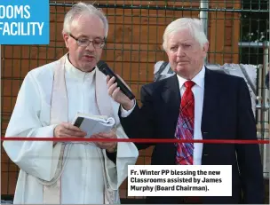  ??  ?? Fr. Winter PP blessing the new Classrooms assisted by James Murphy (Board Chairman).