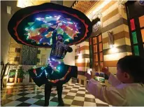  ?? — AFP photos ?? Sufi Dervish dancer Muayad Al-Kharrat, 28, dances with his lit dress at a restaurant in the Shahgur district of the old city of Syria’s capital Damascus.