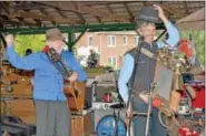  ??  ?? Timothy Walker and David Driskell of the Sadie Green Sales jug band perform at Perkasie Fall Festival.