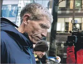  ?? Steven Senne Associated Press ?? WILLIAM “Rick” Singer leaves federal court in Boston. The Esformes fraud case marks the first time Singer is known to have crossed law enforcemen­t’s radar.