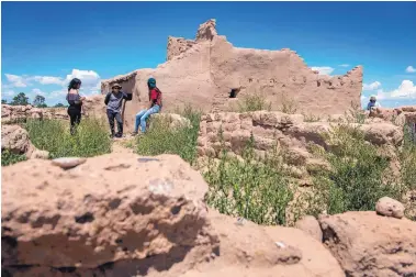  ??  ?? LEFT: Lanaiya Chavarria, Jareth Baca, Kyleigh Dasheno and Aaron Duran are helping to restore the Puye Pueblo ruins.