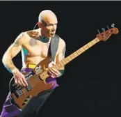  ?? ADAM BETTCHER GETTY IMAGES FILE ?? Bass player Flea and the Red Hot Chili Peppers perform tonight at the new Mission Valley stadium.