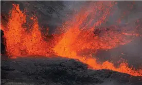  ??  ?? Molten lava spraying during an eruption of the Piton de la Fournaise volcano, on the French Indian Ocean island of La Reunion. Photograph: Richard Bouhet/AFP/Getty Images