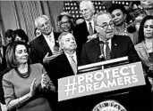  ?? AARON P. BERNSTEIN/GETTY ?? “This list goes so far beyond what is reasonable,” said Nancy Pelosi, left, and Chuck Schumer, behind lectern.