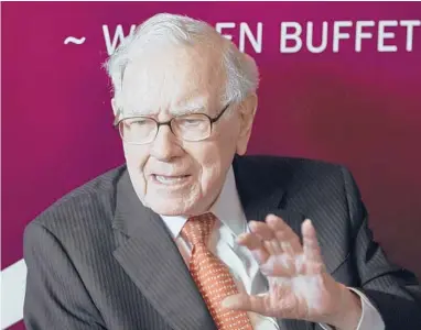 ?? NATI HARNIK/AP ?? Warren Buffett, chairman and CEO of Berkshire Hathaway, speaks following the annual shareholde­rs meeting in 2019.