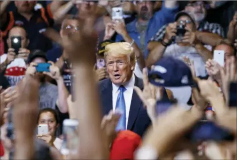  ?? CAROLYN KASTER — THE ASSOCIATED PRESS ?? President Donald Trump is cheered as he arrives for a rally at Mohegan Sun Arena at Casey Plaza in Wilkes Barre, Pa..