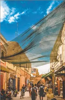  ?? Vlad Solovov ?? SHOPPERS walk through the central medina of Marrakech. There’s much to do in the city between festival engagement­s.