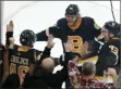  ?? MICHAEL DWYER - THE ASSOCIATED PRESS ?? Boston Bruins’ David Krejci (46) celebrates his winning goal with David Pastrnak (88) and Charlie McAvoy (73) in overtime during an NHL hockey game against the New York Rangers in Boston, Friday, Nov. 29, 2019.