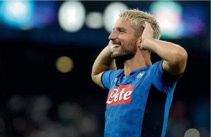  ?? AP ?? Napoli’s Dries Mertens celebrates after scoring the opening goal during his team’s group E clash with Liverpool.