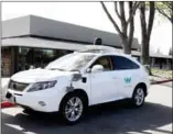  ?? AFP WILSON/THE NEW YORK TIMES JIM ?? A car from Waymo, one of several companies that are becoming partners in Lyft’s Open Platform Initiative on technology for self-driving cars, in Mountain View, California, March 21.