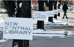  ?? Calgary Herald/files ?? Signage marks the site of the new central library east of City Hall. Reader says the library will be everything Calgarians could want.