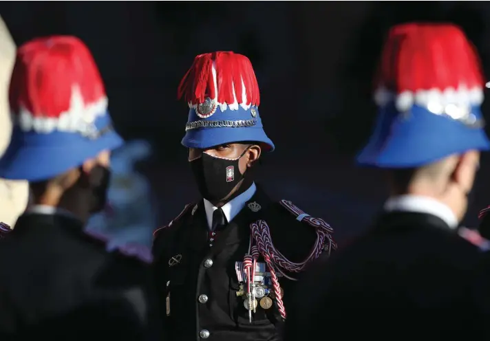  ??  ?? The Prince of Monaco's Carabinier­s await arrivals outside the Monaco cathedral for the ceremonies marking the National Day in Monaco, yesterday. Photo: AP