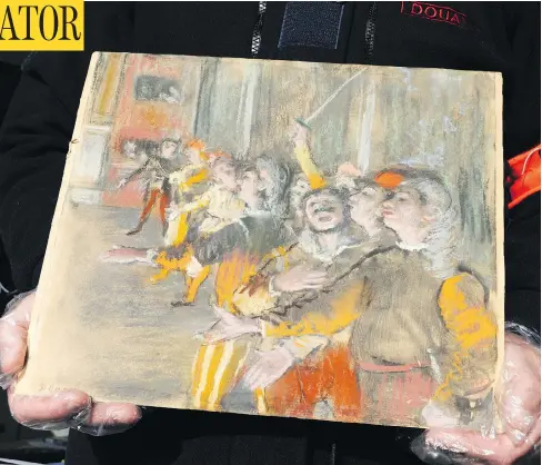  ?? MARC BONODOT / FRENCH CUSTOMS VIA AP ?? French customs officers found this impression­ist painting by Edgar Degas stowed on a bus, more than eight years after it was reported stolen.