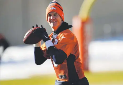  ?? Joe Amon, The Denver Post ?? Broncos quarterbac­k Peyton Manning takes part in practice at the team’s training facility at Dove Valley on Wednesday.