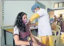  ?? HT FILE PHOTO ?? A student gets jabbed in Navi Mumbai. NMMC has vaccinated 19% in the 12-15 years age group with both the vaccine doses.