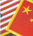  ?? FOTO: IMAGO ?? Fahnen von USA und China. Der Handelsstr­eit beunruhigt auch die deutsche Wirtschaft.