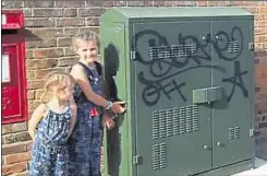  ??  ?? The sisters beside graffiti in Canterbury city centre