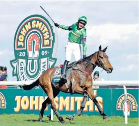  ??  ?? In their prime: Liam Treadwell and Mon Mome win the 2009 Grand National