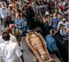  ??  ?? It Is a treasure: Journalist­s take photos of an ancient sarcophagu­s, discovered in a vast necropolis in saqqara, egypt, on saturday. — AP