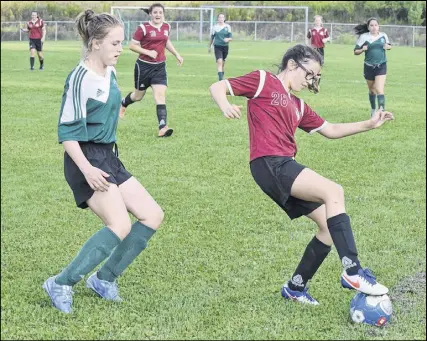  ?? Joey smith/trUro Daily News ?? Jaclyn Sherry of the CC Riders keeps the ball alive near the sideline during the recent Highland Soccer League final against the Antigonish Celtics. Both the Riders and the Celtics will compete at the N.S. U13 tournament this weekend at Harmony Heights and King Street fields.