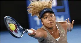  ?? AP ?? Naomi Osaka of Japan plays a forehand during a singles match against Andrea Petkovic of Germany Jan. 7. Osaka is a four-time Grand Slam champion who helped spark a conversati­on about athletes’ mental health when she pulled out of last year’s French Open and revealed that she has dealt with anxiety and depression.