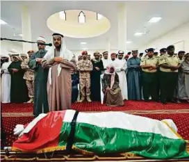  ?? Clint Egbert/Gulf News ?? People gather for the funeral prayers of Ahmad Rashid Salim Ali Al Mazroui at Kaab Bin Zaid Mosque in Kalba.