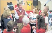  ?? STEVE HELBER — THE ASSOCIATED PRESS FILE ?? Virginia Republican gubernator­ial candidate Glenn Youngkin greets supporters during a meet and greet at a sports bar in Chesapeake, Va. Youngkin faces former Governor Terry McAuliffe in the November election.